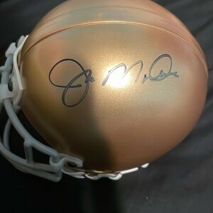 Collectibles item ,signed by Joe Montana small helmet